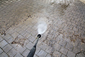 cleaning-outdoor-paved-pathway--with-high-pressure-water-jet