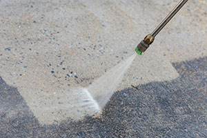 close-up-of-property-outdoor-cement-floor-cleaning-with-high-pressure-water-jet