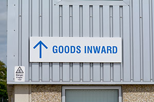goods-inward-sign-on-industrial-building