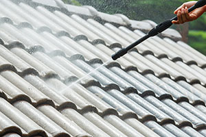 power-washing-roof-tiles-of-house