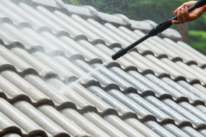 cleaning-roof-tiles-of-house-with-power-washing