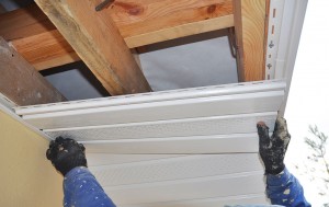 repairing-white-soffit-on-house