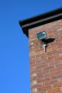security-light-at-top-of-high-building-wall